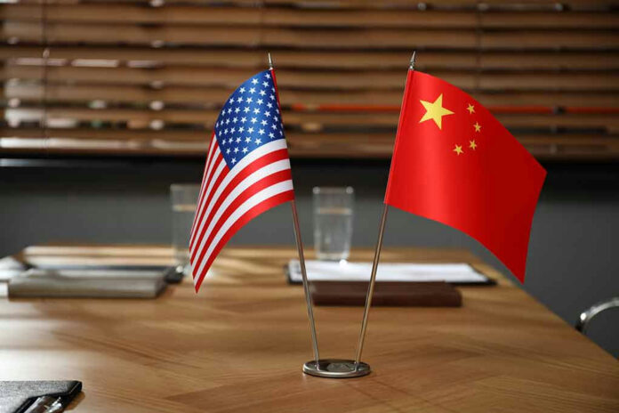 American and Chinese flags on a table.