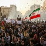 Large crowd of protesters holding Iranian flags and signs during a demonstration