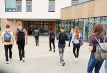 CSU’s Settlement Ends—Accountability Fight Does Not Students with backpacks walking toward a school entrance
