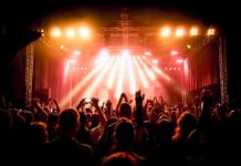 Fans Soaked, Show Scrapped — Why So Late? concert crowd under bright stage lights