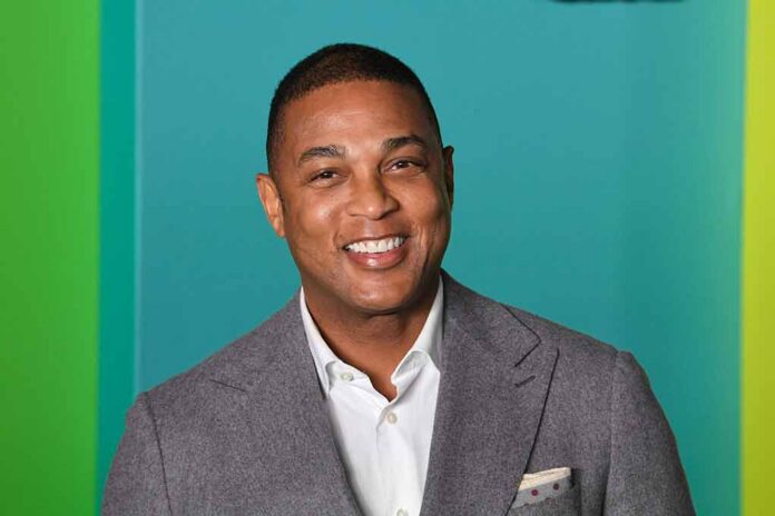 shutterstock_1549227497 smiling man in gray suit against teal background