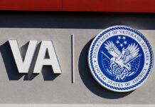 A Fake Benefit With Real Consequences VA logo and Department of Veterans Affairs seal on building wall