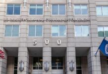 Abolish ICE? Michigan Stunner Explodes US government building facade with flags and number 500