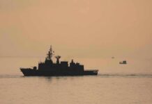 Frozen Iranian Funds Become New Pressure Point naval ship silhouette at sea during sunset
