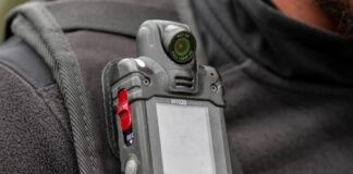 Close-up of a body camera attached to a persons shoulder