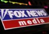 Close-up of the Fox News media logo on a digital screen