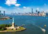 Statue of Liberty with New York City skyline background.